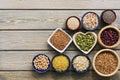 A set of various superfoods Ã¢â¬â whole grains,beans, seeds, legumes in bowls on a wooden plank table. Top view, copy space Royalty Free Stock Photo